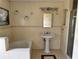 Bathroom featuring a vanity sink, bathtub, and a glass-enclosed shower at 260 Piccolo Way, Davenport, FL 33896