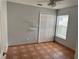This bedroom features neutral walls, built-in shelving, a ceiling fan, and a double-door closet at 260 Piccolo Way, Davenport, FL 33896