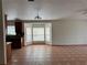 Open kitchen and living area with bay window and tiled floors at 260 Piccolo Way, Davenport, FL 33896