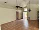 Open-concept living area boasts tile flooring, high ceilings, and natural light at 260 Piccolo Way, Davenport, FL 33896