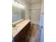 Bathroom with a single sink vanity and a shower-tub combo at 2728 Portchester Ct, Kissimmee, FL 34744