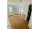 Bright bedroom featuring wood floors, a ceiling fan, and a closet at 2728 Portchester Ct, Kissimmee, FL 34744