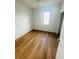 Bright bedroom with hardwood flooring and a window providing natural light at 2728 Portchester Ct, Kissimmee, FL 34744