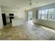 Bright eat-in kitchen with white cabinets, modern appliances, and large windows offering lots of light at 2728 Portchester Ct, Kissimmee, FL 34744