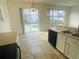 Eat-in kitchen with views of the pool through large windows and sliding glass doors at 2728 Portchester Ct, Kissimmee, FL 34744