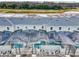 Aerial view of community showcasing newly built homes with screened in pools overlooking a beautiful wooded area at 2970 Protagonist St, Kissimmee, FL 34746