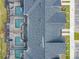 Birds eye view of the community roofs, screened in pools and community parking spaces with lawn area at 2970 Protagonist St, Kissimmee, FL 34746