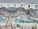 Aerial view of multiple screened-in pools and patios, showcasing the backyard layout of the homes at 2970 Protagonist St, Kissimmee, FL 34746