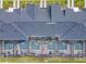 Aerial view of rooftops with screened-in pools, overlooking lush green lawns and parking spots at 2970 Protagonist St, Kissimmee, FL 34746