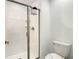 Bathroom featuring a glass enclosed shower and toilet, providing a clean and functional space at 2970 Protagonist St, Kissimmee, FL 34746