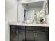 Bright bathroom featuring double vanity and glass-enclosed shower at 2970 Protagonist St, Kissimmee, FL 34746