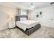 Bedroom featuring a bed with upholstered headboard, bedside tables and neutral décor, offering a calming retreat at 2970 Protagonist St, Kissimmee, FL 34746