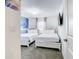 Bright bedroom with two beds, ceiling fan, and themed decorations at 2970 Protagonist St, Kissimmee, FL 34746