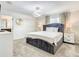 Bedroom featuring a bed with upholstered headboard, bedside tables and neutral décor, offering a calming retreat at 2970 Protagonist St, Kissimmee, FL 34746
