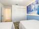 Bedroom with closet and 'Frozen' themed accent wall, offering ample storage space and playful decor at 2970 Protagonist St, Kissimmee, FL 34746