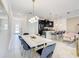 Open-concept dining area leads to a modern kitchen and comfortable seating area, great for entertaining at 2970 Protagonist St, Kissimmee, FL 34746