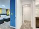 Hallway view leading to a bedroom and bathroom, enhanced by modern finishes and neutral tones at 2970 Protagonist St, Kissimmee, FL 34746