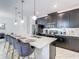 Stylish kitchen with a large island, barstool seating, and pendant lighting at 2970 Protagonist St, Kissimmee, FL 34746