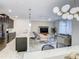 Stylish kitchen seamlessly connects to the living area, enhancing the home's open and inviting ambiance at 2970 Protagonist St, Kissimmee, FL 34746