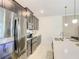 Modern kitchen featuring stainless steel appliances, sleek cabinetry, and a functional layout at 2970 Protagonist St, Kissimmee, FL 34746