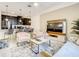 Bright and open living space with kitchen island, comfortable seating, and contemporary design at 2970 Protagonist St, Kissimmee, FL 34746