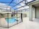 Enclosed backyard pool with safety fence and covered patio area, perfect for recreation and relaxation at 2970 Protagonist St, Kissimmee, FL 34746