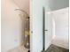 Utility closet featuring a hot water tank, clean tile floors, and access to additional storage at 2970 Protagonist St, Kissimmee, FL 34746