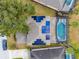 Aerial shot of home featuring solar panels and a screened pool at 303 Plumoso Loop, Davenport, FL 33897