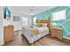 Bright bedroom featuring a comfortable bed, modern décor, and ample natural light from the windows at 303 Plumoso Loop, Davenport, FL 33897