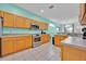 Modern kitchen with stainless steel appliances, granite countertops, and ample cabinetry at 303 Plumoso Loop, Davenport, FL 33897
