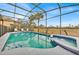 Inviting pool and spa area surrounded by lush landscaping, perfect for relaxation at 303 Plumoso Loop, Davenport, FL 33897