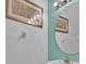 Stylish powder room with a large mirror and decorative accents at 303 Plumoso Loop, Davenport, FL 33897