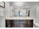 Bathroom featuring a great mirror, large vanity, and generous lighting at 320 Southern Winds Blvd, Deland, FL 32720