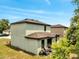 Home's exterior featuring a grill, lush green space and a sunny atmosphere at 320 Southern Winds Blvd, Deland, FL 32720