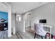 Hallway area with built in desk and computer and luxury vinyl plank flooring; great work from home space at 320 Southern Winds Blvd, Deland, FL 32720