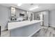 Well-equipped kitchen featuring quartz countertops, gray cabinetry, and stainless steel appliances at 320 Southern Winds Blvd, Deland, FL 32720
