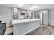 Spacious kitchen features modern gray cabinetry and quartz countertops for a sleek design at 320 Southern Winds Blvd, Deland, FL 32720