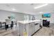 Open-concept kitchen and living area with a large island, ideal for modern living and socializing at 320 Southern Winds Blvd, Deland, FL 32720