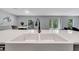 Bright kitchen island with a double sink, perfect for food preparation and entertaining guests at 320 Southern Winds Blvd, Deland, FL 32720