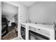 Practical laundry room featuring a washer, dryer, and access to the garage for convenience at 320 Southern Winds Blvd, Deland, FL 32720