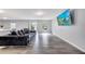 Spacious living room features durable flooring, neutral walls, large sectional sofa, and tv at 320 Southern Winds Blvd, Deland, FL 32720