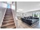 Bright living room showcases an open floor plan and stylish gray tones, ideal for modern living and entertaining at 320 Southern Winds Blvd, Deland, FL 32720