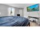Cozy main bedroom featuring nice TV and plenty of natural light at 320 Southern Winds Blvd, Deland, FL 32720