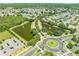 This aerial view showcases a well-planned community with scenic ponds, lush landscaping, and convenient road networks at 3203 Herons Point Cir, Kissimmee, FL 34741