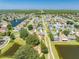 An aerial view of the house, showing it is on a cul-de-sac next to a pond at 3203 Herons Point Cir, Kissimmee, FL 34741