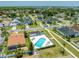 Aerial view of a neighborhood featuring a community pool with lounge chairs at 3203 Herons Point Cir, Kissimmee, FL 34741