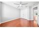 Bedroom with hardwood floors, neutral walls, closet with double doors, and ceiling fan at 3203 Herons Point Cir, Kissimmee, FL 34741