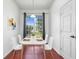 Cozy dining nook with a modern table, seating for four, and a large window at 3203 Herons Point Cir, Kissimmee, FL 34741
