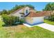 Charming two-story home with a well-manicured lawn and attached two-car garage at 3203 Herons Point Cir, Kissimmee, FL 34741