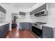 Well-designed kitchen with sleek gray cabinets, stainless steel appliances, and ample counter space at 3203 Herons Point Cir, Kissimmee, FL 34741